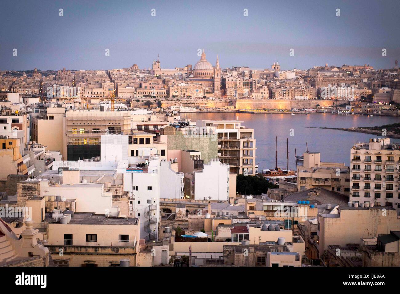 view of Valetta (in background on horizon) from Sliema (in foreground) , Malta Stock Photo