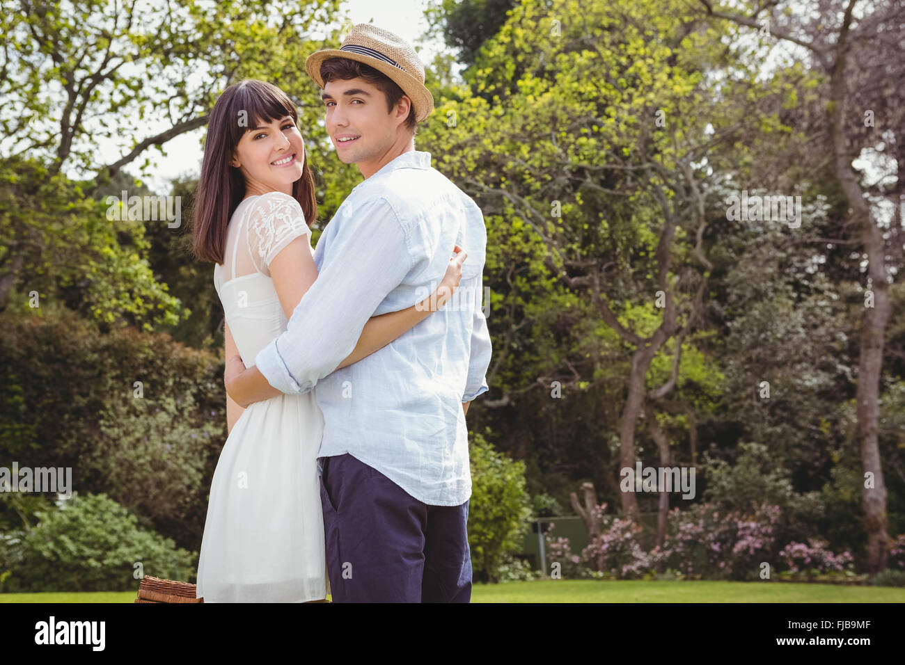 Adorable young couple standing hi-res stock photography and images - Alamy