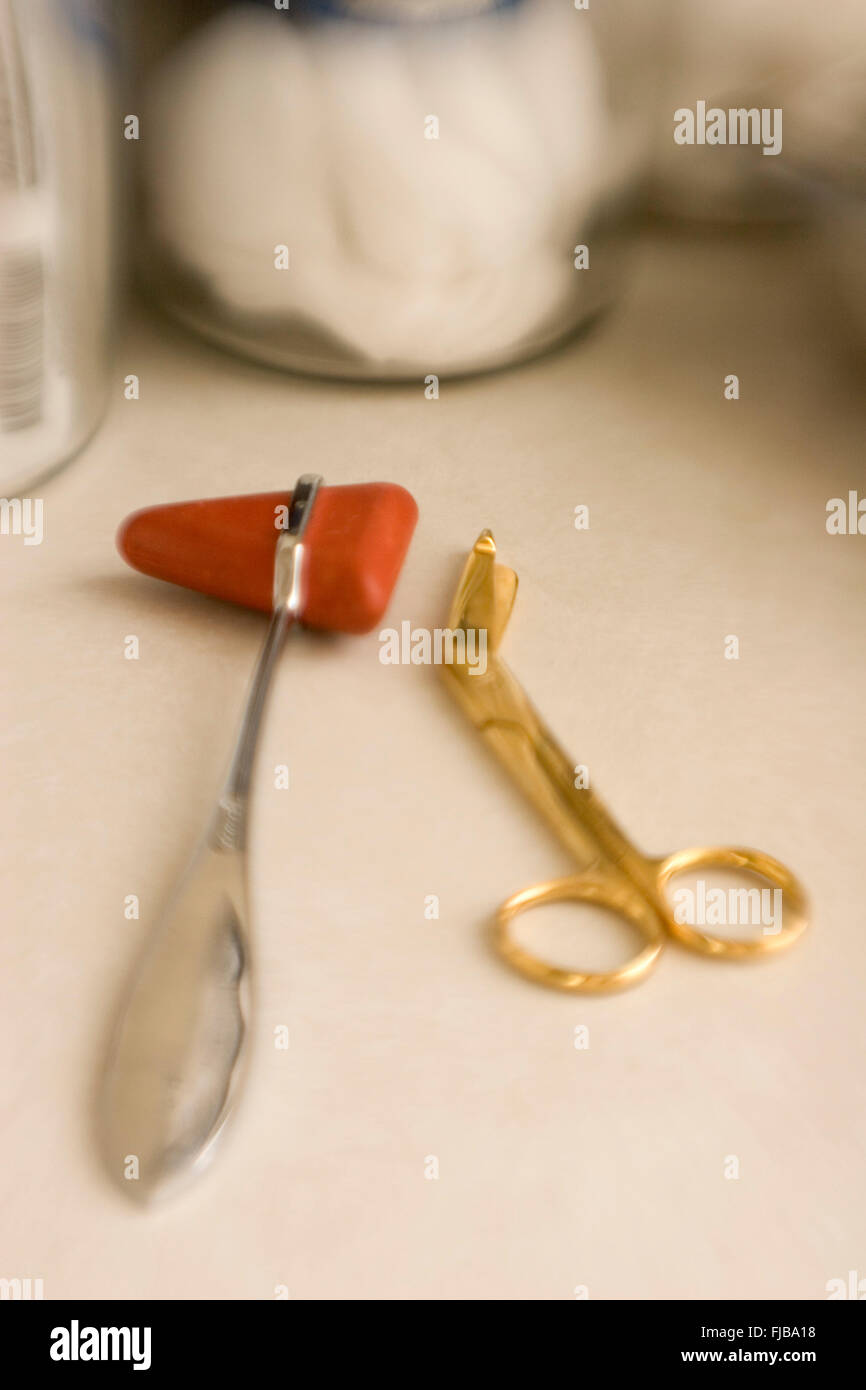 Taylor hammer and scissors. Medical instruments. Blurred effect. Stock Photo