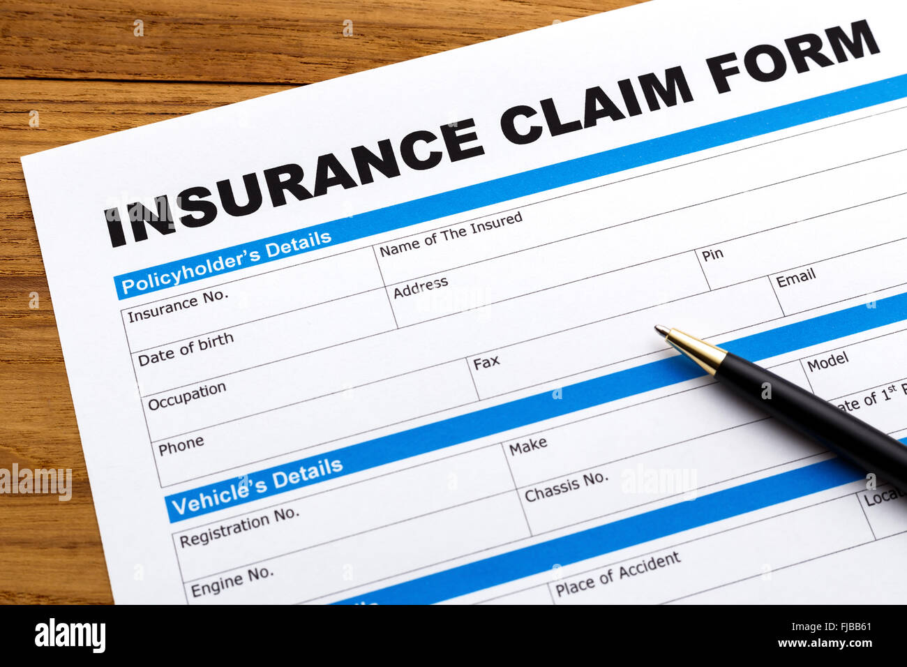 Insurance claim form with pen Stock Photo