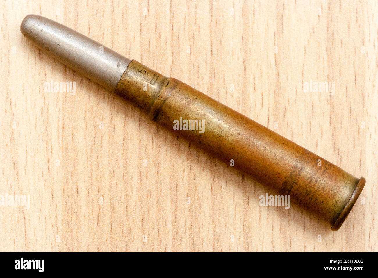 Machine gun bullet from the first world war against wood grain background  Stock Photo - Alamy