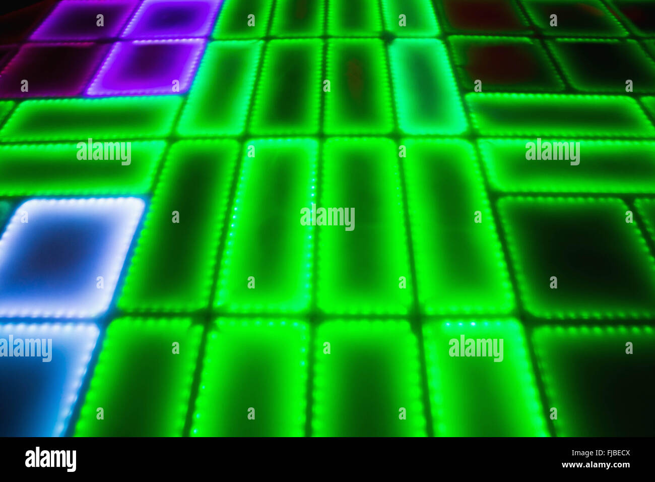 Green illuminated disco dance floor Stock Photo