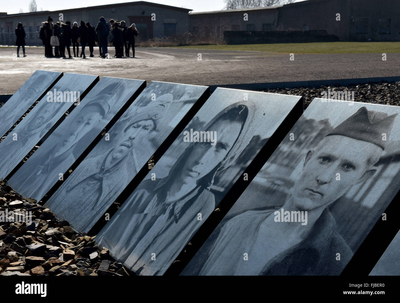 Oranienburg, Germany. 1st Mar, 2016. Photographs of Soviet soldiers who were shot, pictured at the former execution site, at the former Sachsenhausen concentration camp in Oranienburg, Germany, 1 March 2016. A special exhibition at the site will remember the murders of more than 12,000 Soviet prisoners of war. Photo: Bernd Settnik/dpa/Alamy Live News Stock Photo