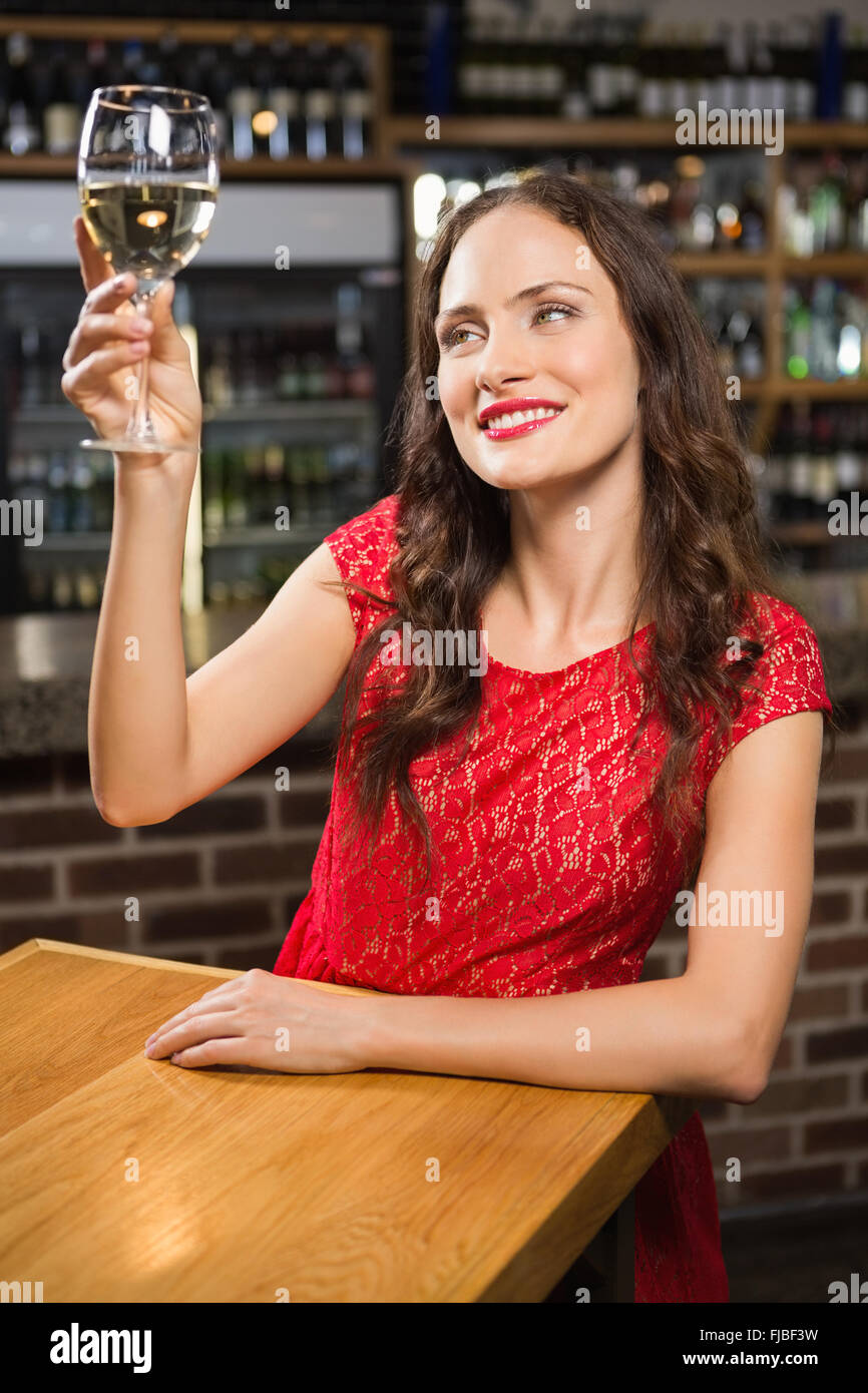 Pretty woman having a glass of wine Stock Photo - Alamy
