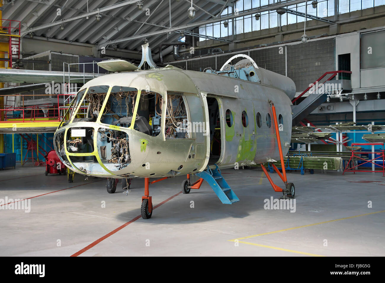 Kiev, Ukraine - July 7, 2012: Mi-8 helicopter during maintencance and repair at the service hangar Stock Photo