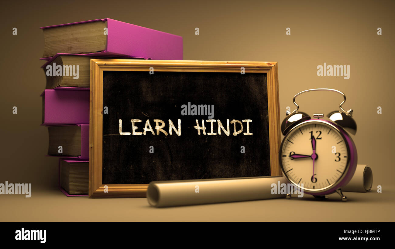 Hand Drawn Learn Hindi Concept on Chalkboard. Stock Photo