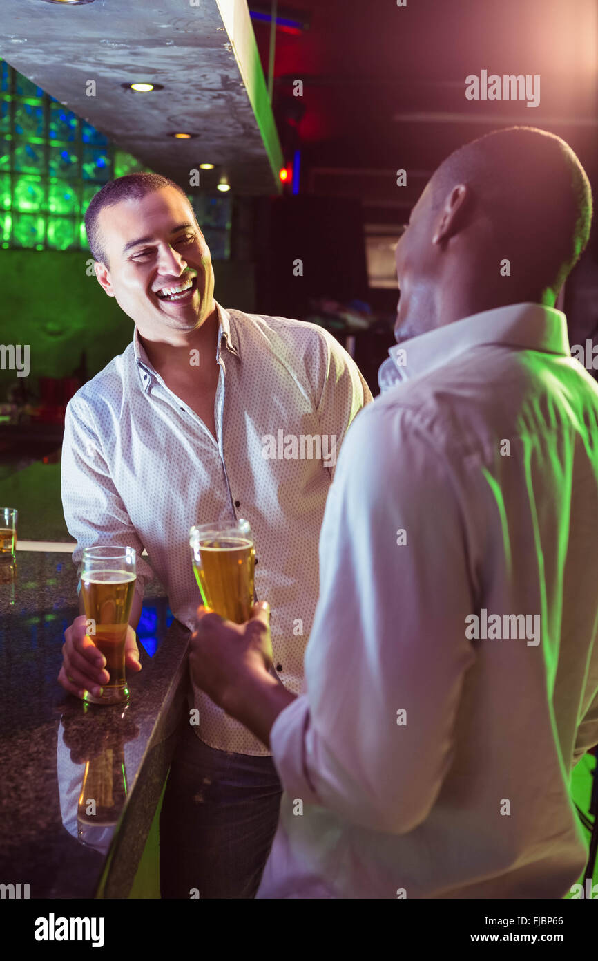 Two men having beer at bar Stock Photo