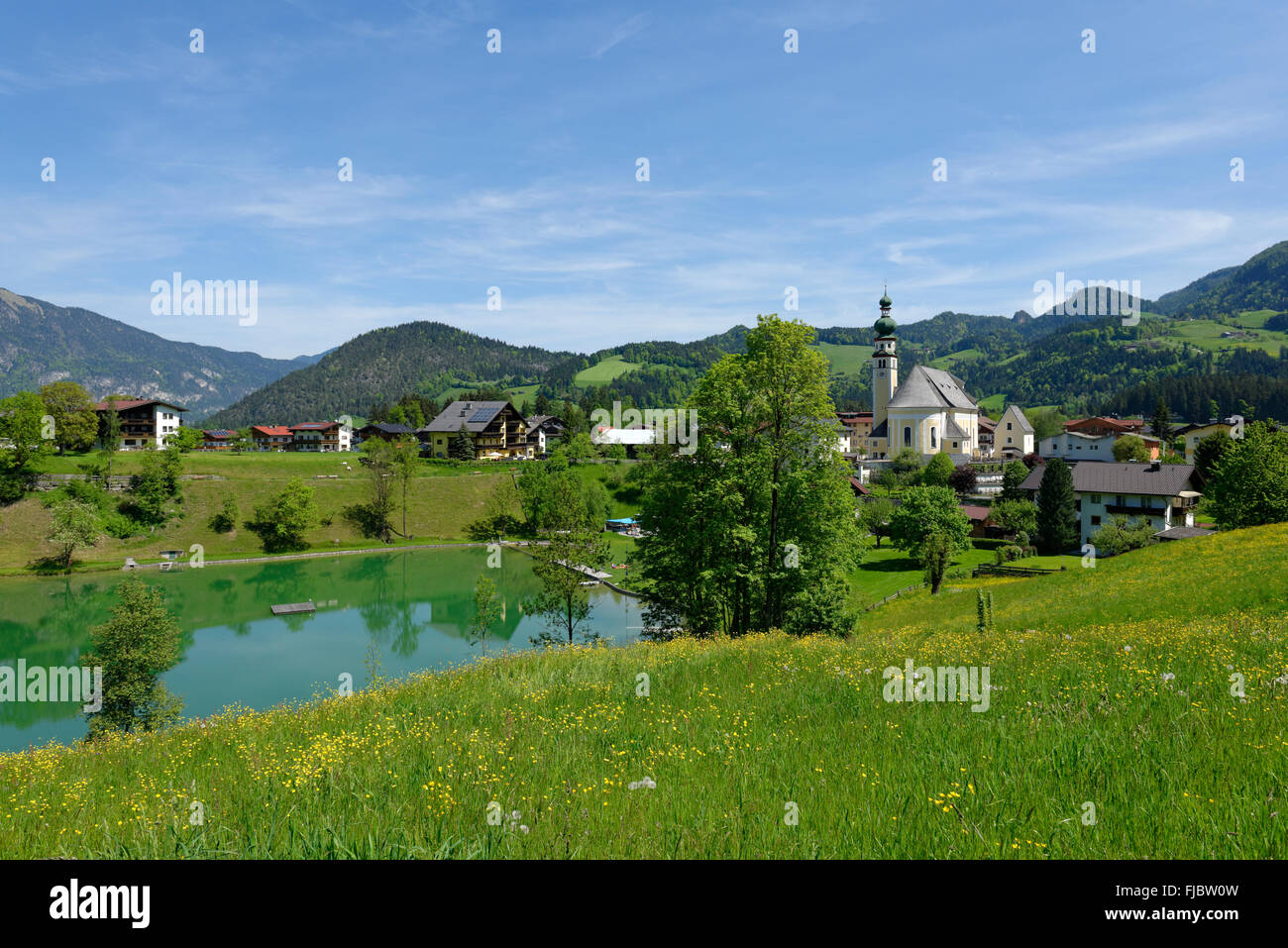 Parish church and Lake Reith, Alpbach, Tyrol, Austria Stock Photo