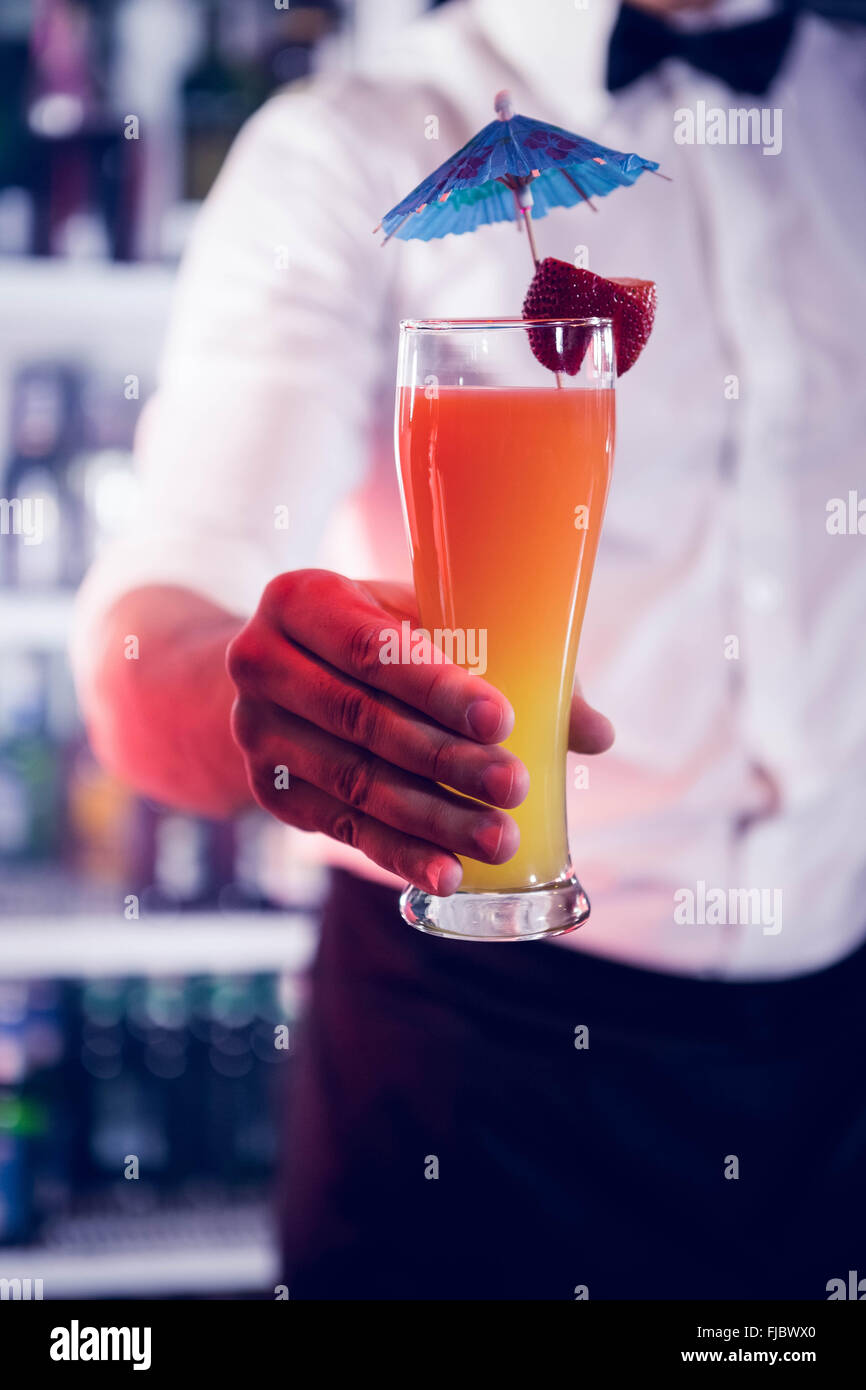 Bartender serving a cocktail Stock Photo
