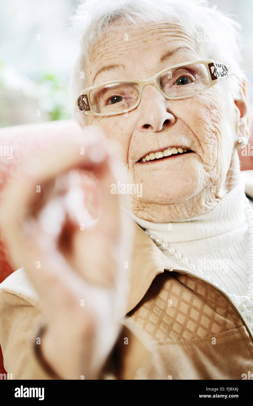 Senior suffering from dementia in her room at the nursing home, in a conversation, portrait, North Rhine-Westphalia, Germany Stock Photo