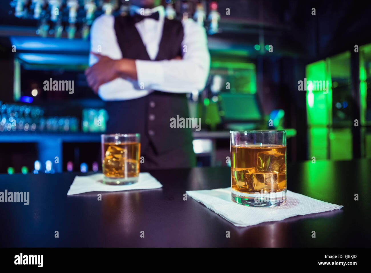 Two glasses of whiskey on bar counter Stock Photo