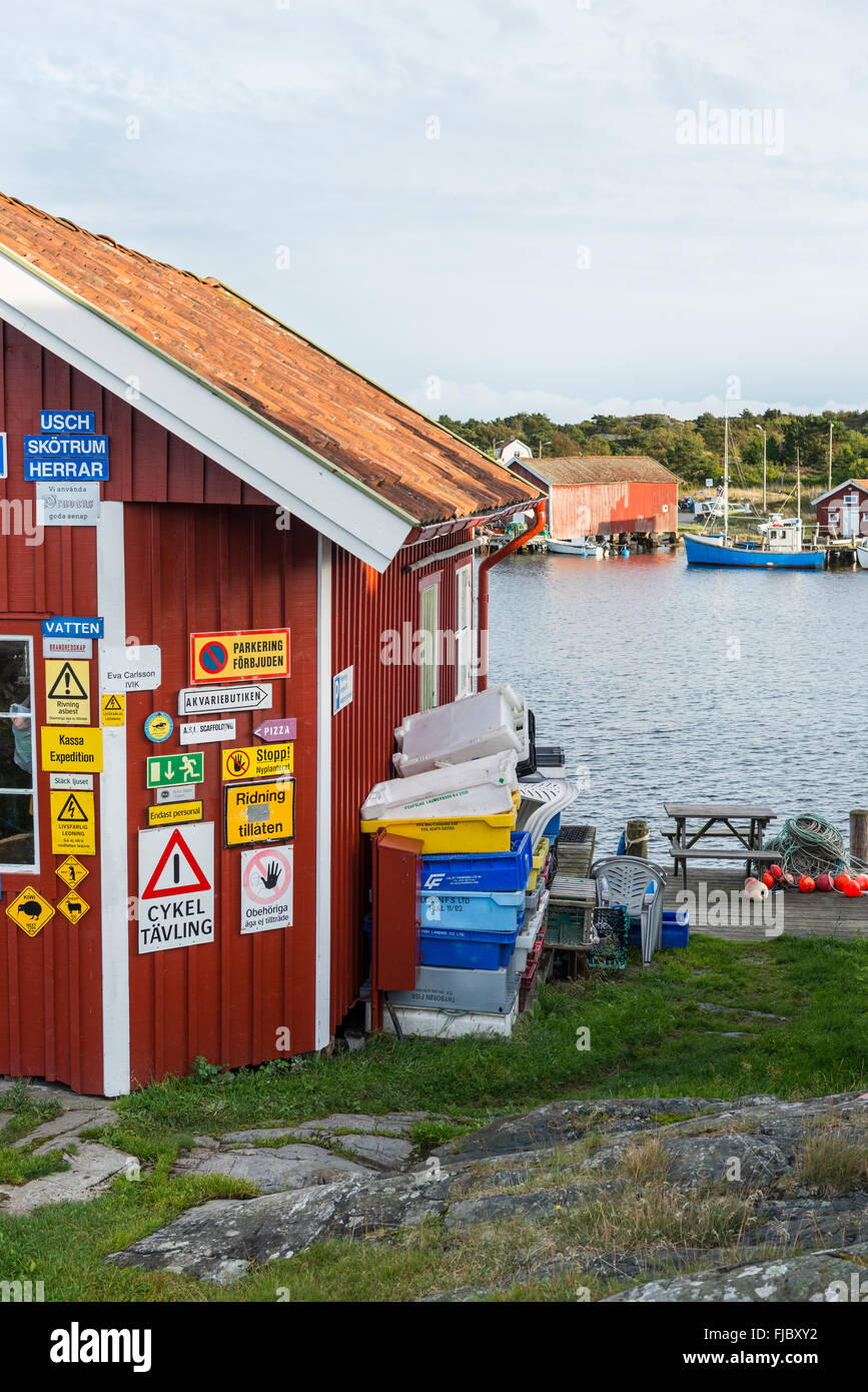 Sign collection on house wall. Bohuslän, Sweden Stock Photo