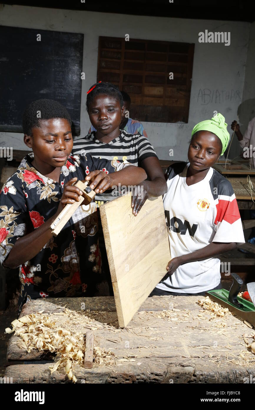 Apprentices planing wood, carpentry and joinery workshop, Matamba-Solo, Bandundu Province, Republic of the Congo Stock Photo
