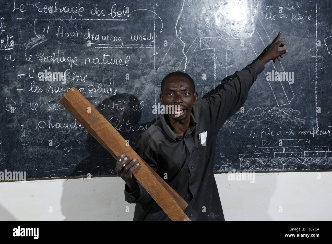 Teacher at blackboard, carpentry and joinery workshop, Matamba-Solo, Bandundu Province, Republic of the Congo Stock Photo