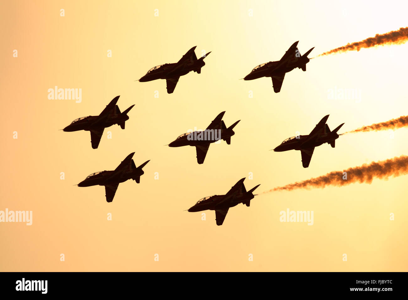 Red Arrows, air display team, eight Hawk aircraft in formation, silhouetted, United Kingdom
