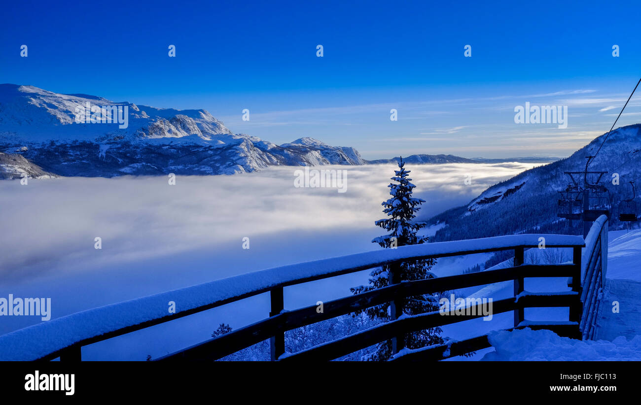 view over a cloud filled valley, Skarsnuten hotel, Hemsedal, Norway Stock Photo