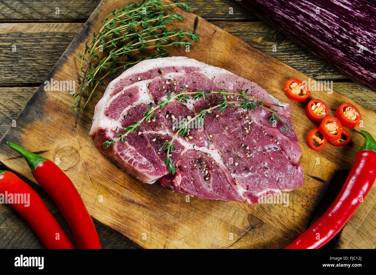 Cooking steak with thyme and chilli Stock Photo Alamy