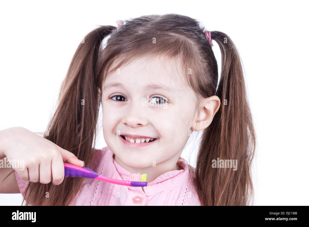 Child decayed teeth with toothbrush on white background Stock Photo