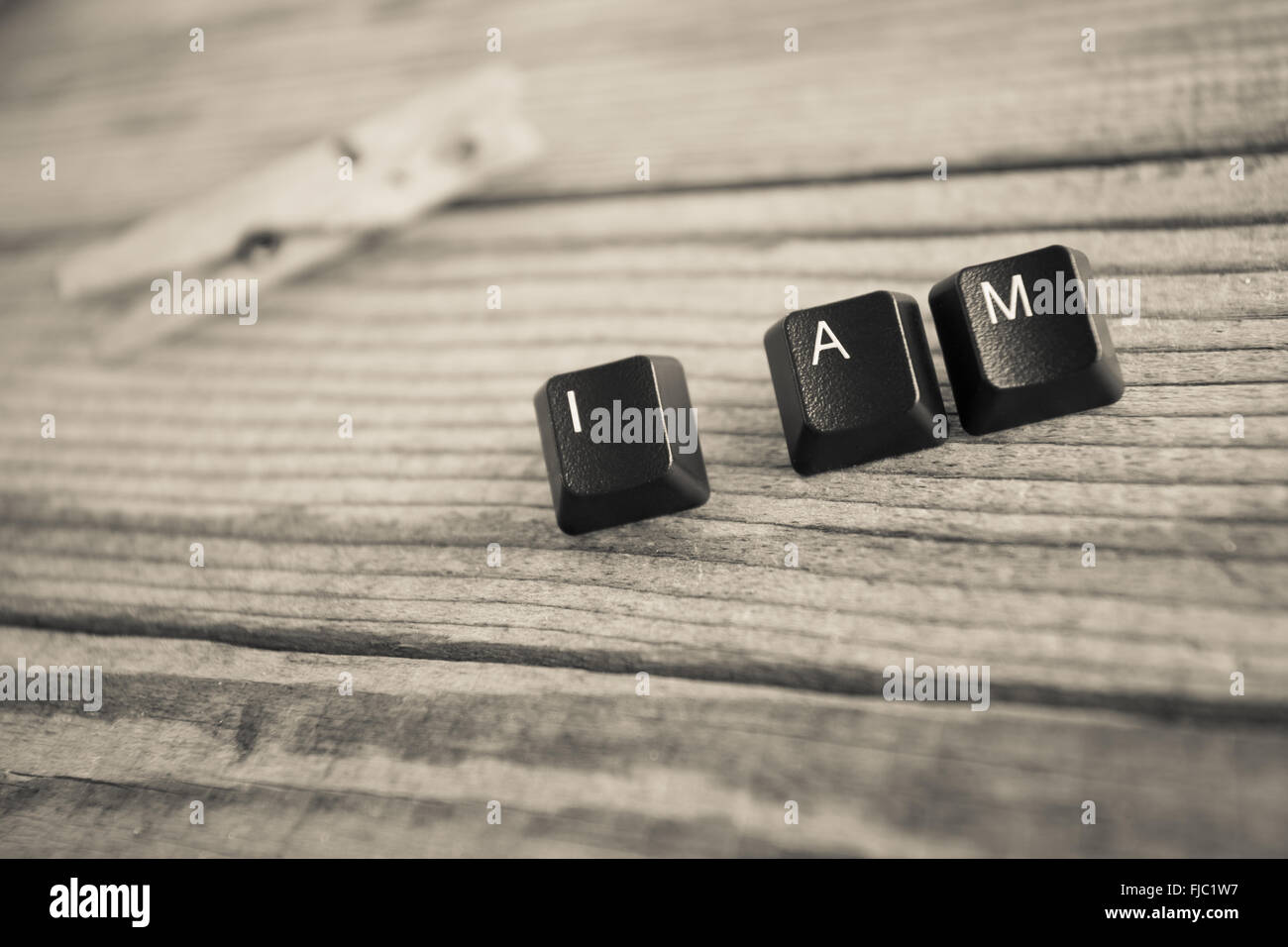 I AM wrote with keyboard keys on wooden background Stock Photo