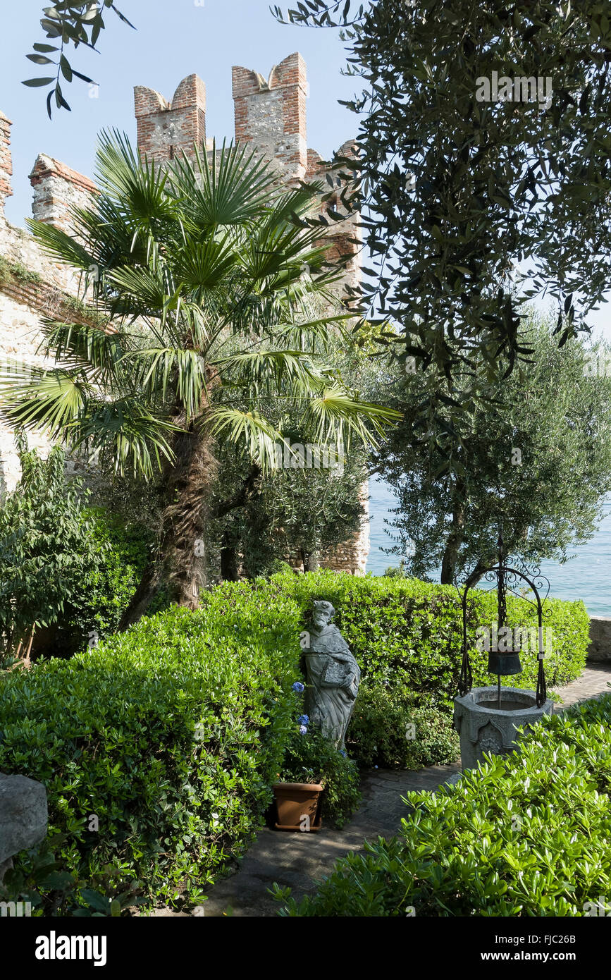 Holy figure in the garden by the lake, Old Town, Sirmione, Lake Garda, Lombardy, Italy Stock Photo