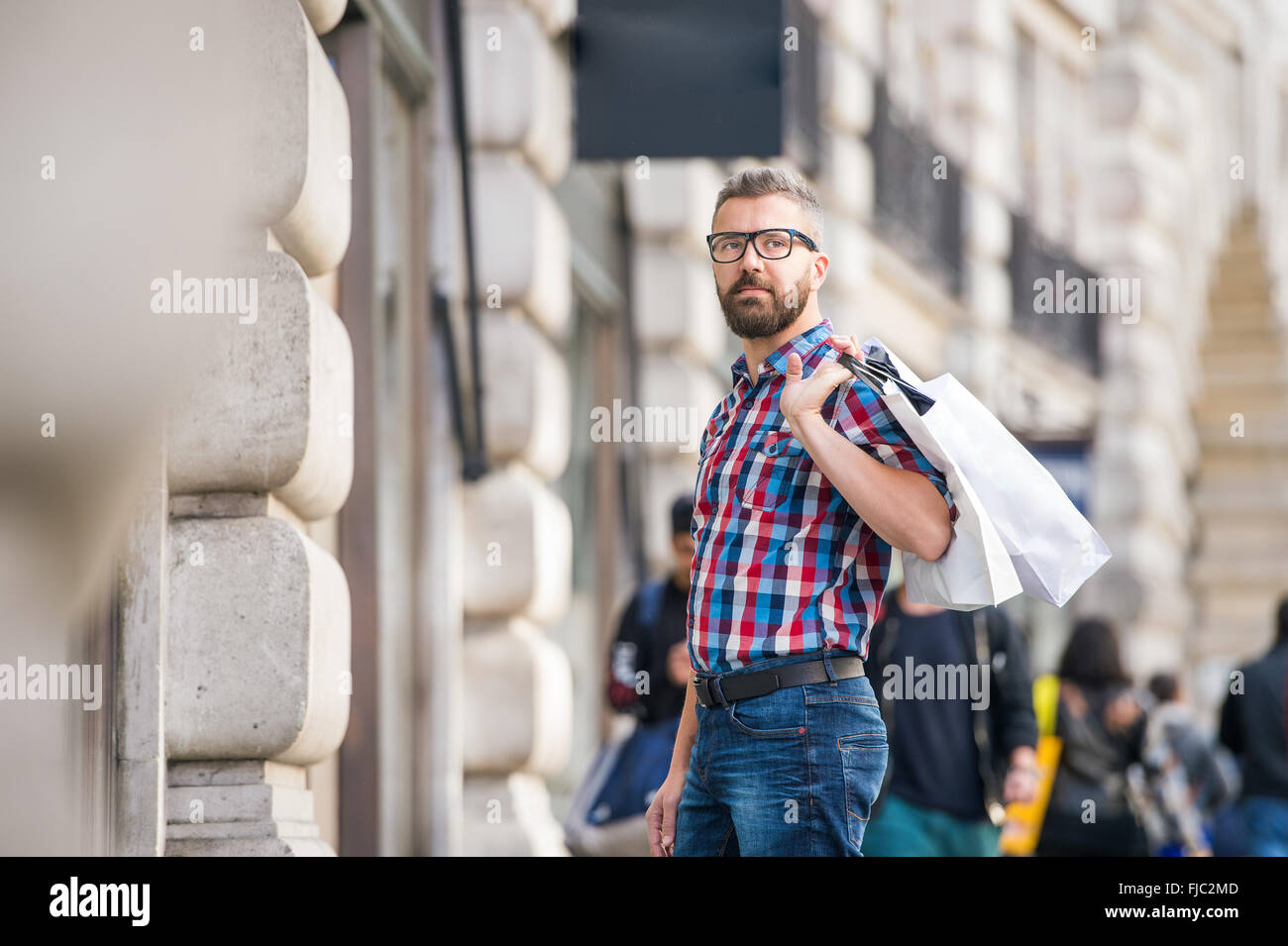 Hipster man shopping in the streets of London Stock Photo