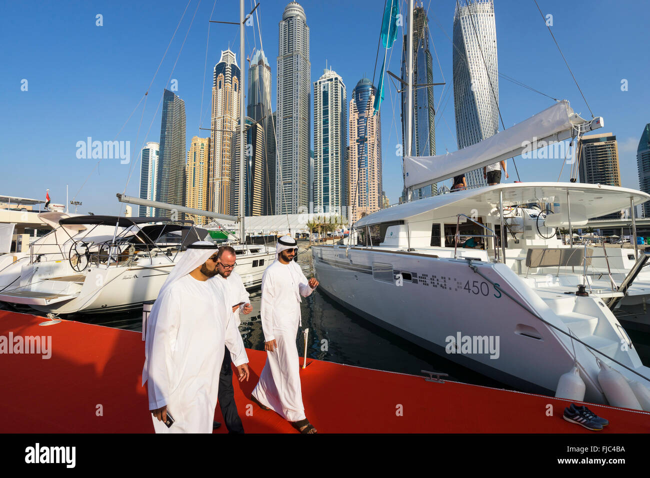 Luxury yachts on display on the opening day of the Dubai International Boat Show 2016 Stock Photo