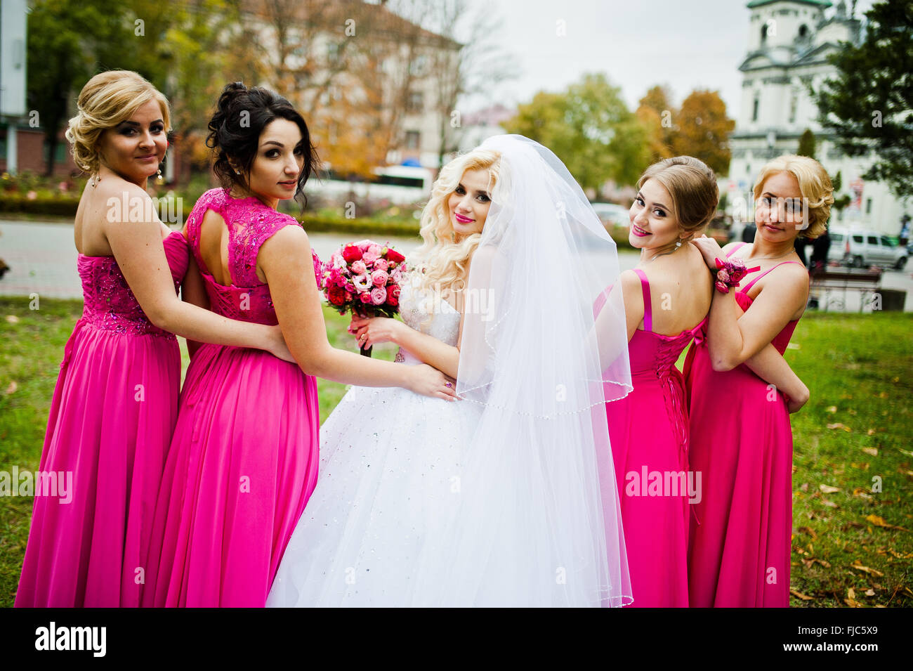 Four bridesmaids having fun with bride Stock Photo - Alamy