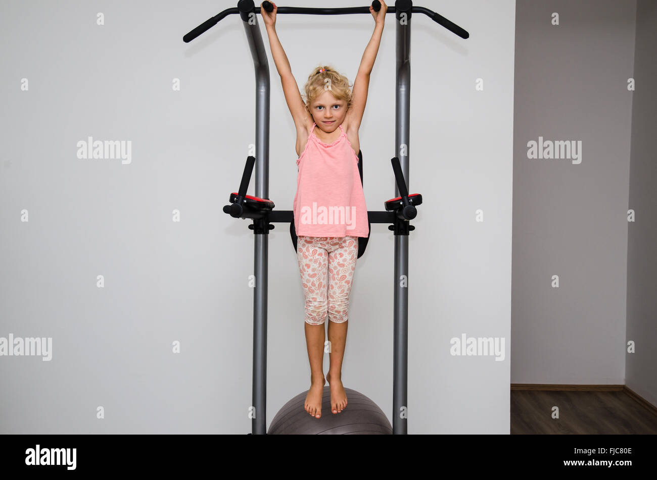 little blond girl working out in the gym Stock Photo Alamy