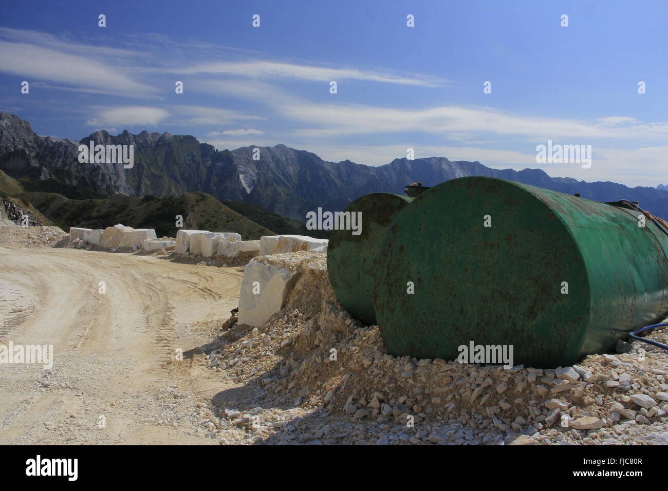 Water drums and road at mountain top marble quarry Stock Photo Alamy