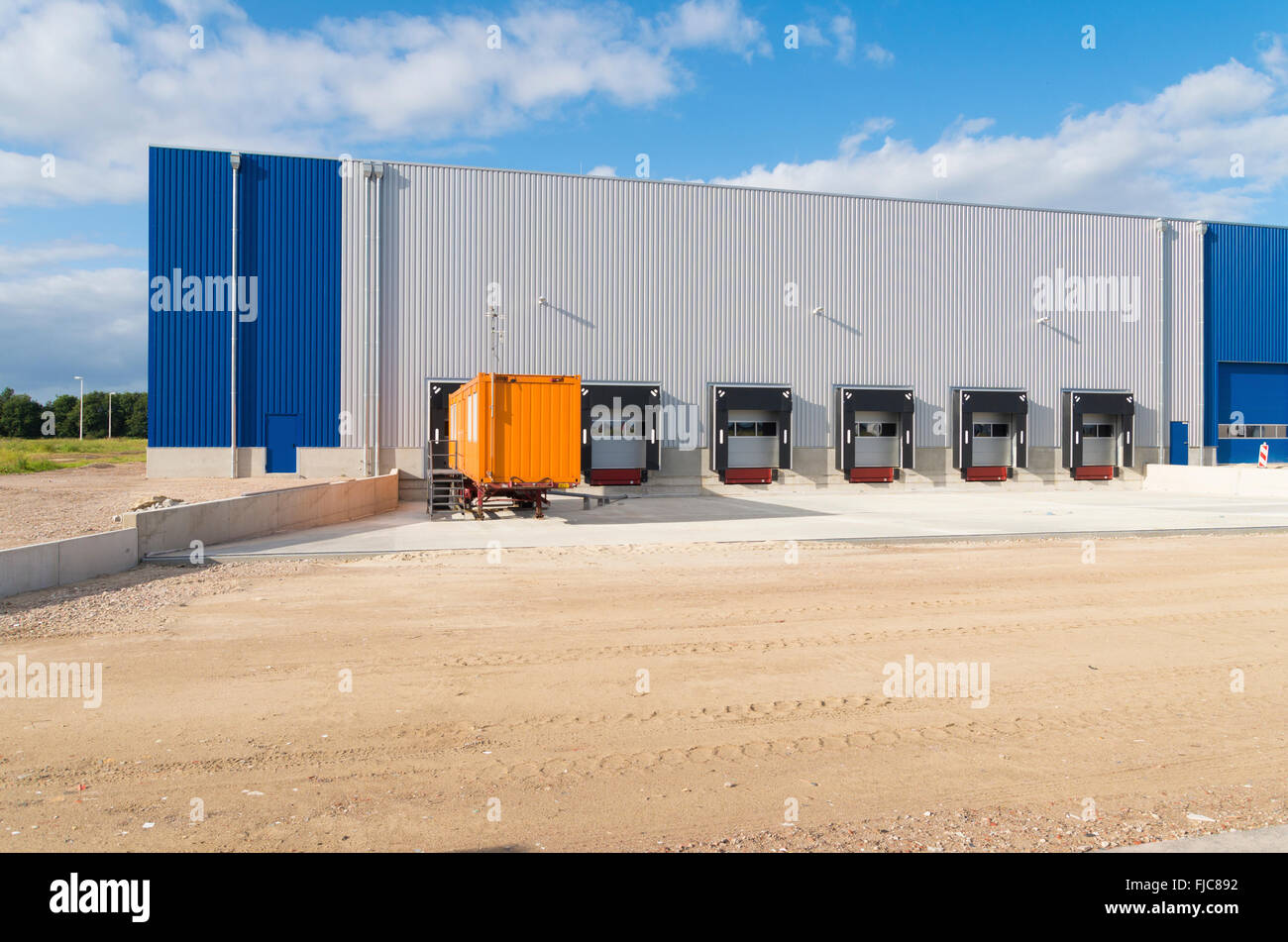 exterior of a newly build warehouse with loading docks Stock Photo