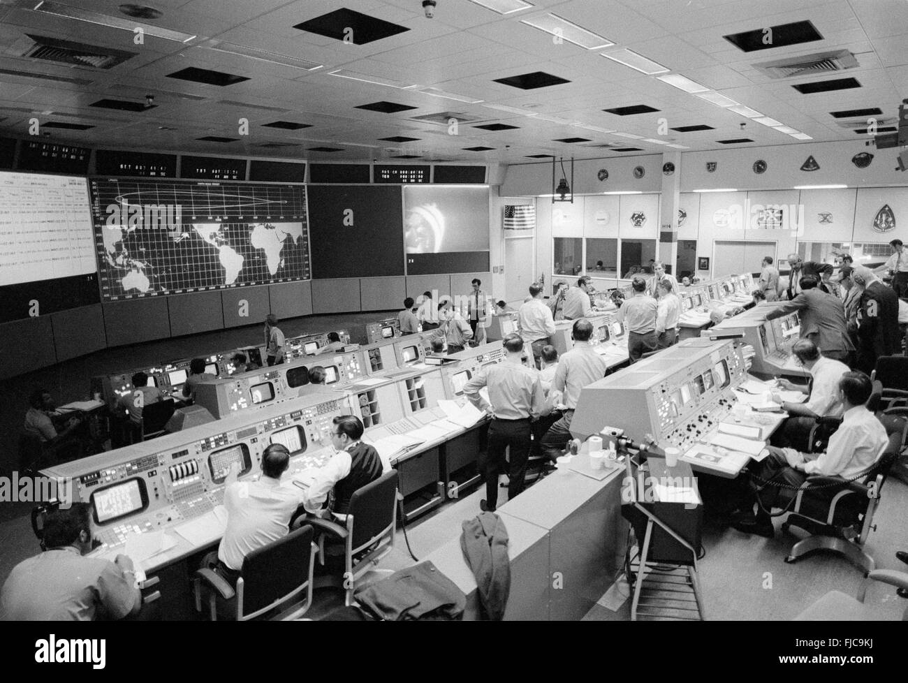 Overall view of activity in the Mission Operations Control Room in the Mission Control Center during the Apollo 14 transposition and docking maneuvers January 31, 1971 in Cape Canaveral, Florida. Due to a docking mechanism problem six attempts were made before a successful docking of the Command Module with the Lunar Module was completed. Stock Photo