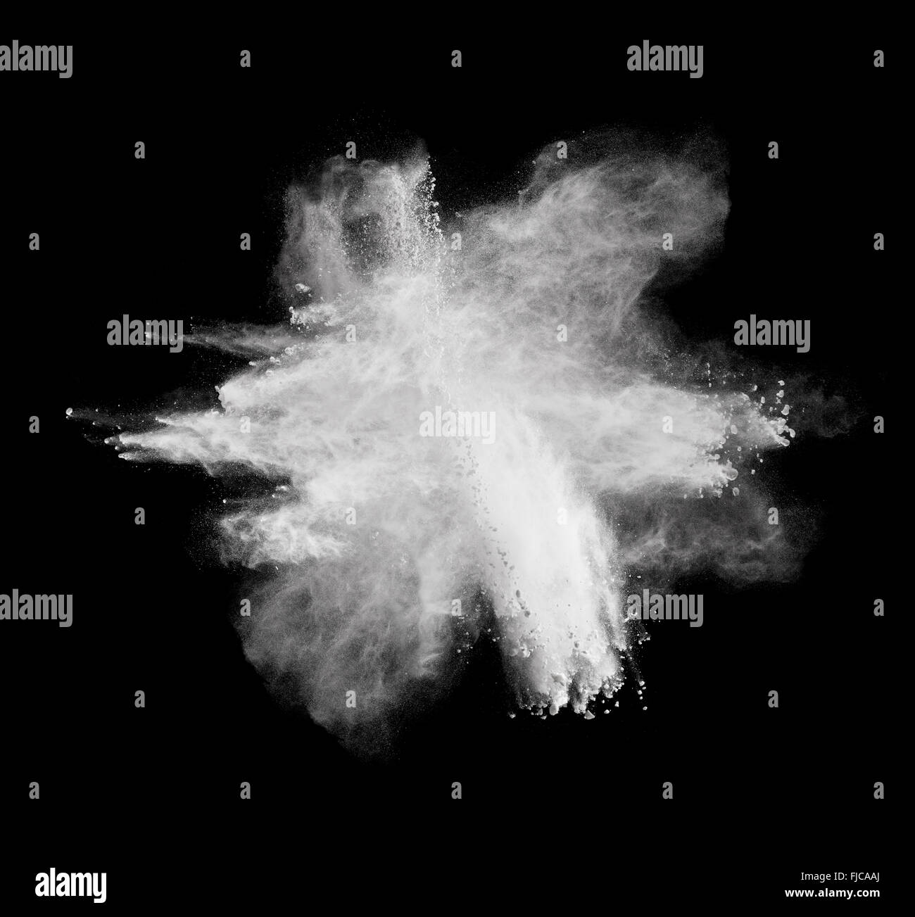 White powder explosion isolated on black background Stock Photo - Alamy