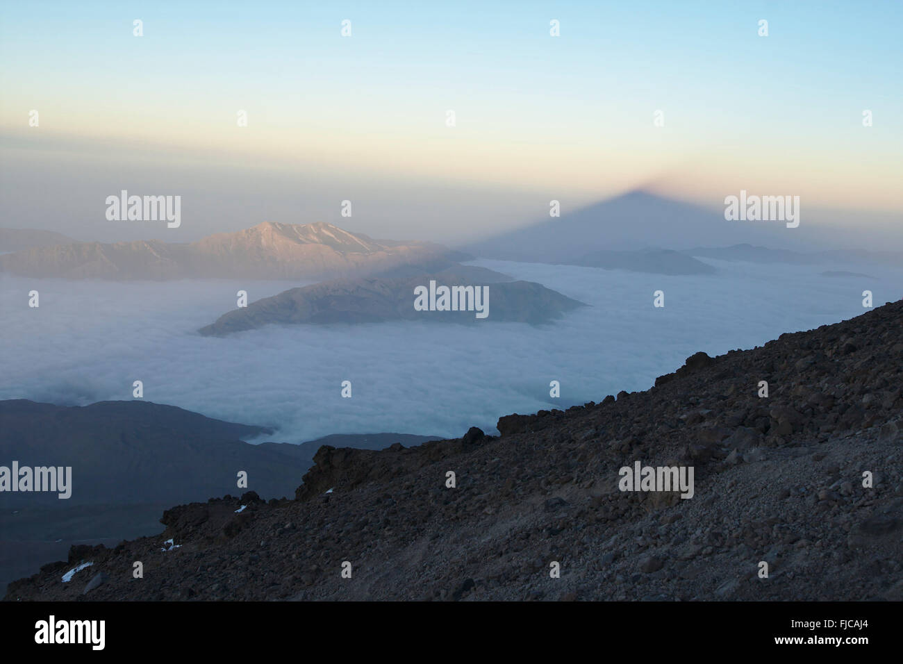 View from the ascent to Mount Damavand across the Alborz mountains, with shadow of the volcano, early morning, Iran Stock Photo