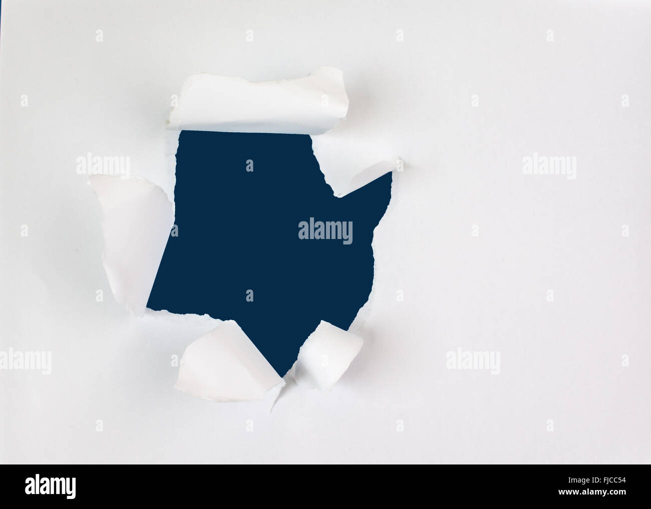 Beige circle shape breakthrough paper hole with white background Stock ...