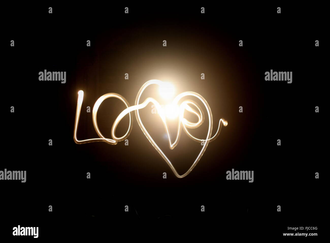 The word 'Love' with a heart around it. Stock Photo