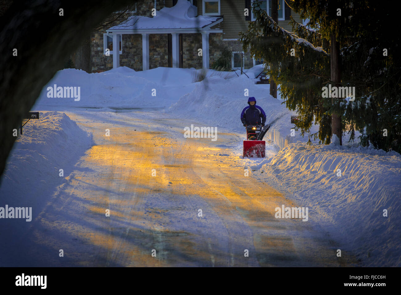 Man Using Snowblower to Clear Snow Away, Philadelphia Suburb, USA Stock Photo