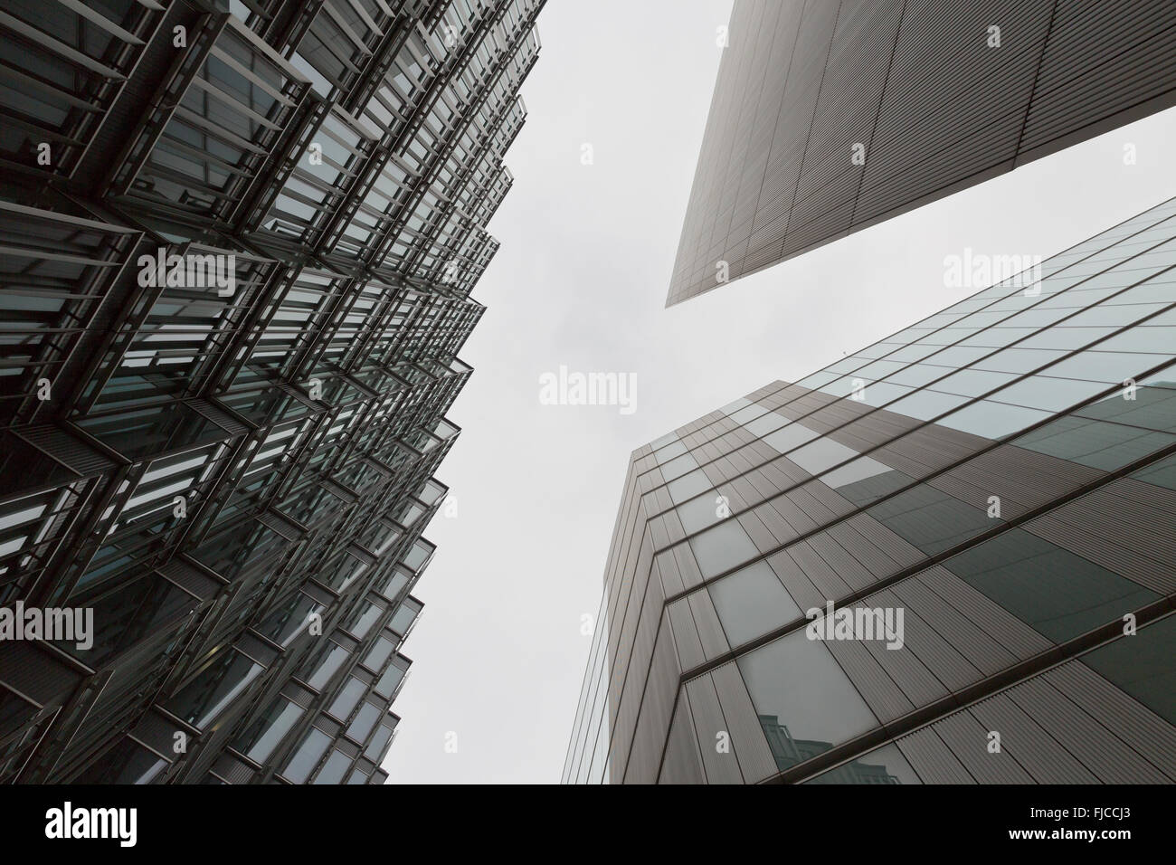 A coloured photo looking up capturing three different buildings on a holirzontal angle with Stock Photo