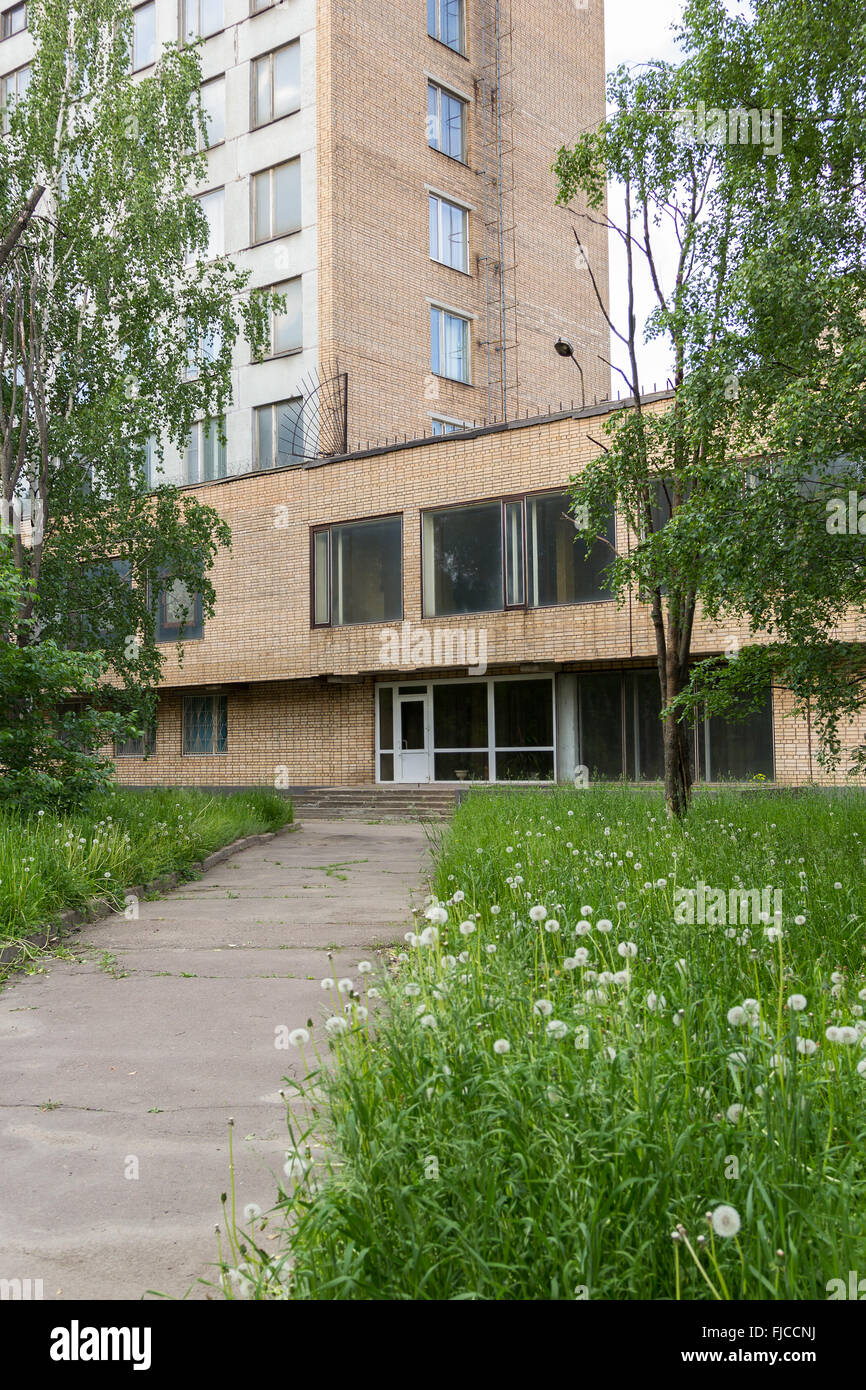 old brick office building surrounded by greenery Stock Photo Alamy