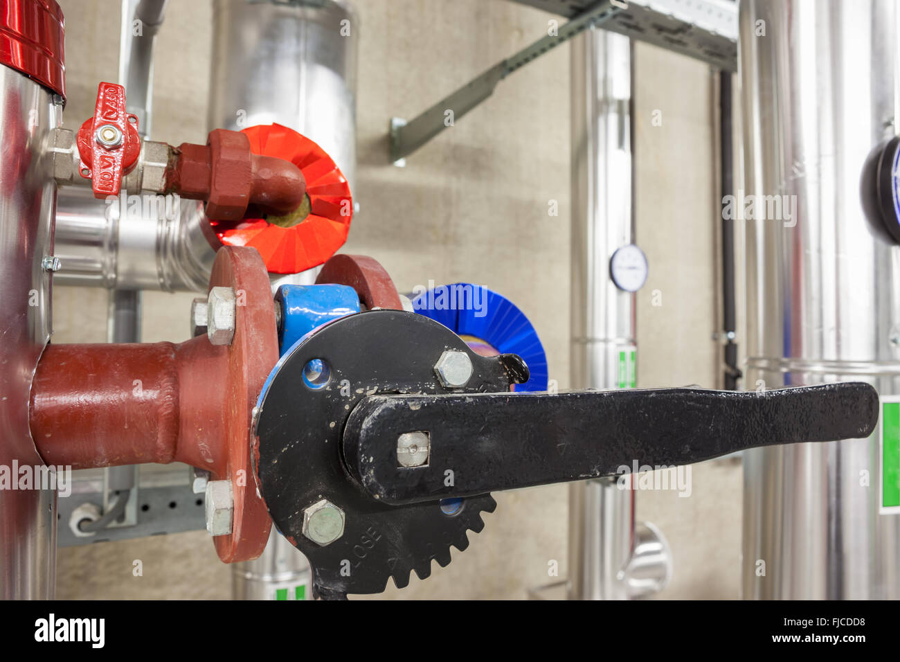 in an large building, there is an collector heating with an butterfly valve Stock Photo