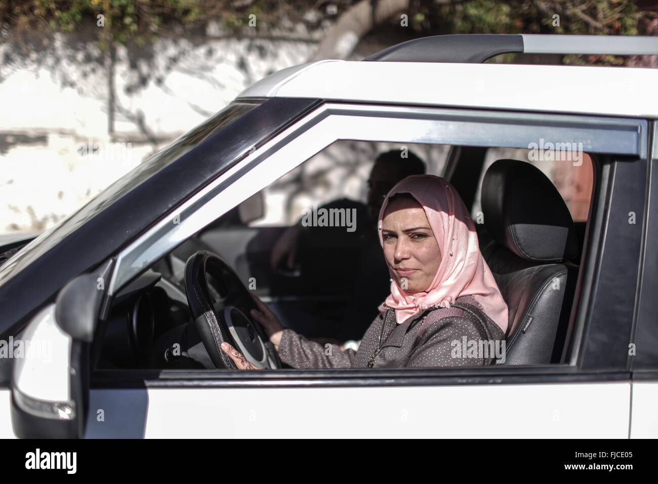 Gaza. 1st Mar, 2016. A Palestinian young woman drives a car belonging to a driving school during her lesson in Gaza City, March 1, 2016. A new regulation in Gaza for women to be accompanied by chaperones for driving lessons with male instructors has stirred a debate. © Wissam Nassar/Xinhua/Alamy Live News Stock Photo
