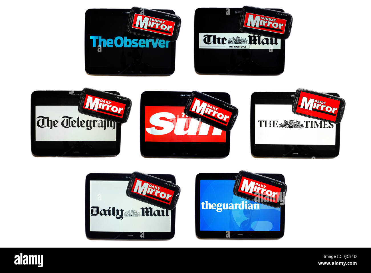 The Daily Mirror newspaper logo on smartphone screens surrounded by tablets displaying the logos of rival newspapers. Stock Photo