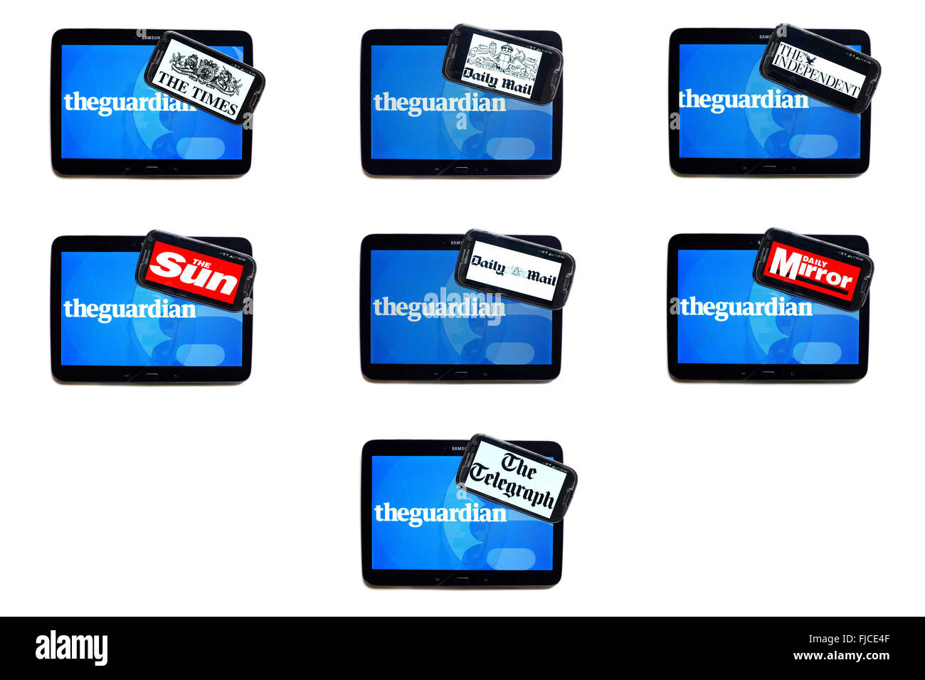 The Guardian newspaper logo on tablet screens surrounded by smartphones displaying the logos of rival newspapers. Stock Photo