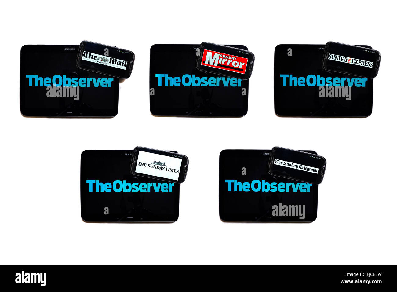 The Observer newspaper logo on tablet screens surrounded by smartphones displaying the logos of rival newspapers. Stock Photo