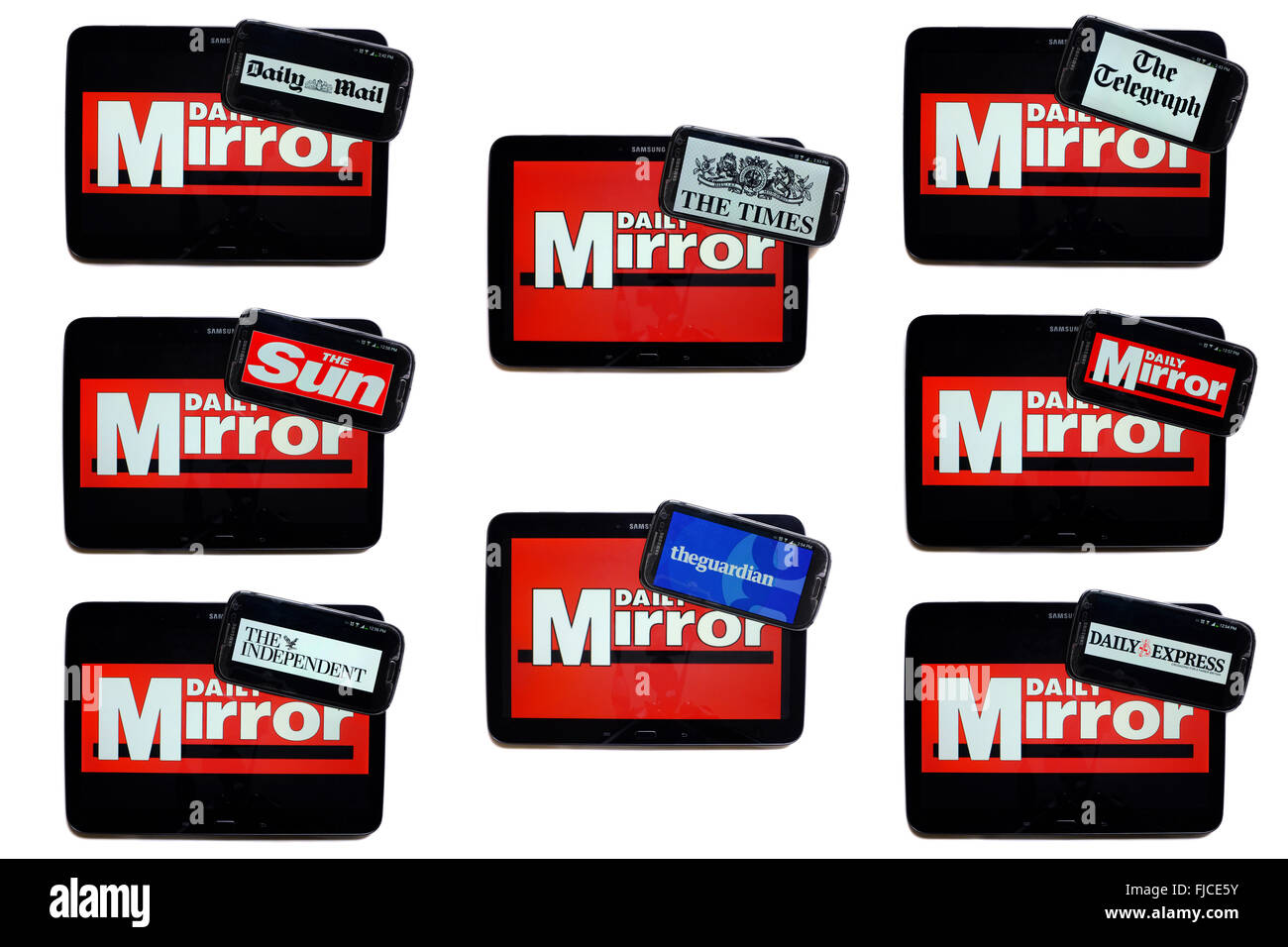 The Daily Mirror newspaper logo on tablet screens surrounded by smartphones displaying the logos of rival newspapers. Stock Photo