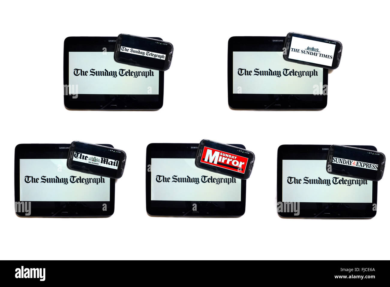 The Sunday Telegraph newspaper logo on tablet screens surrounded by smartphones displaying the logos of rival newspapers. Stock Photo