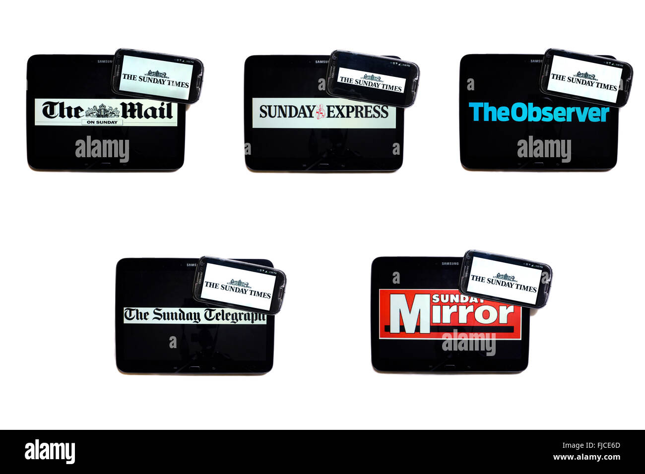 The Sunday Times newspaper logo on smartphones screens surrounded by tablets displaying the logos of rival newspapers. Stock Photo