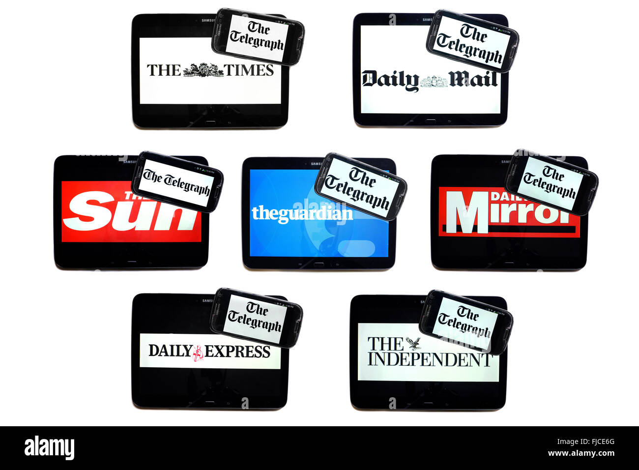 The Telegraph newspaper logo on smartphone screens surrounded by tablets displaying the logos of rival newspapers. Stock Photo