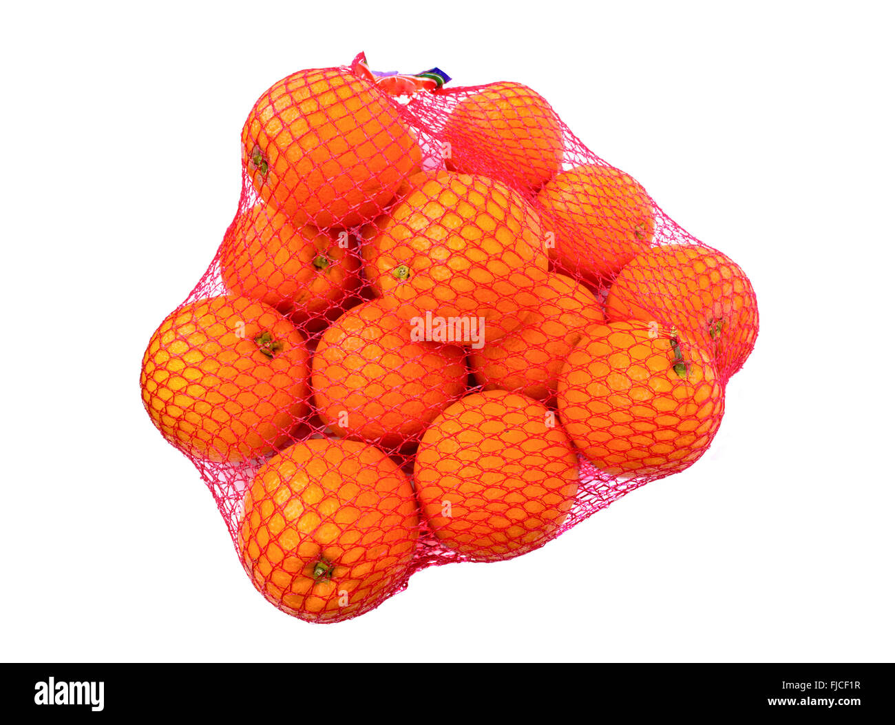 Oranges in net over white background Stock Photo