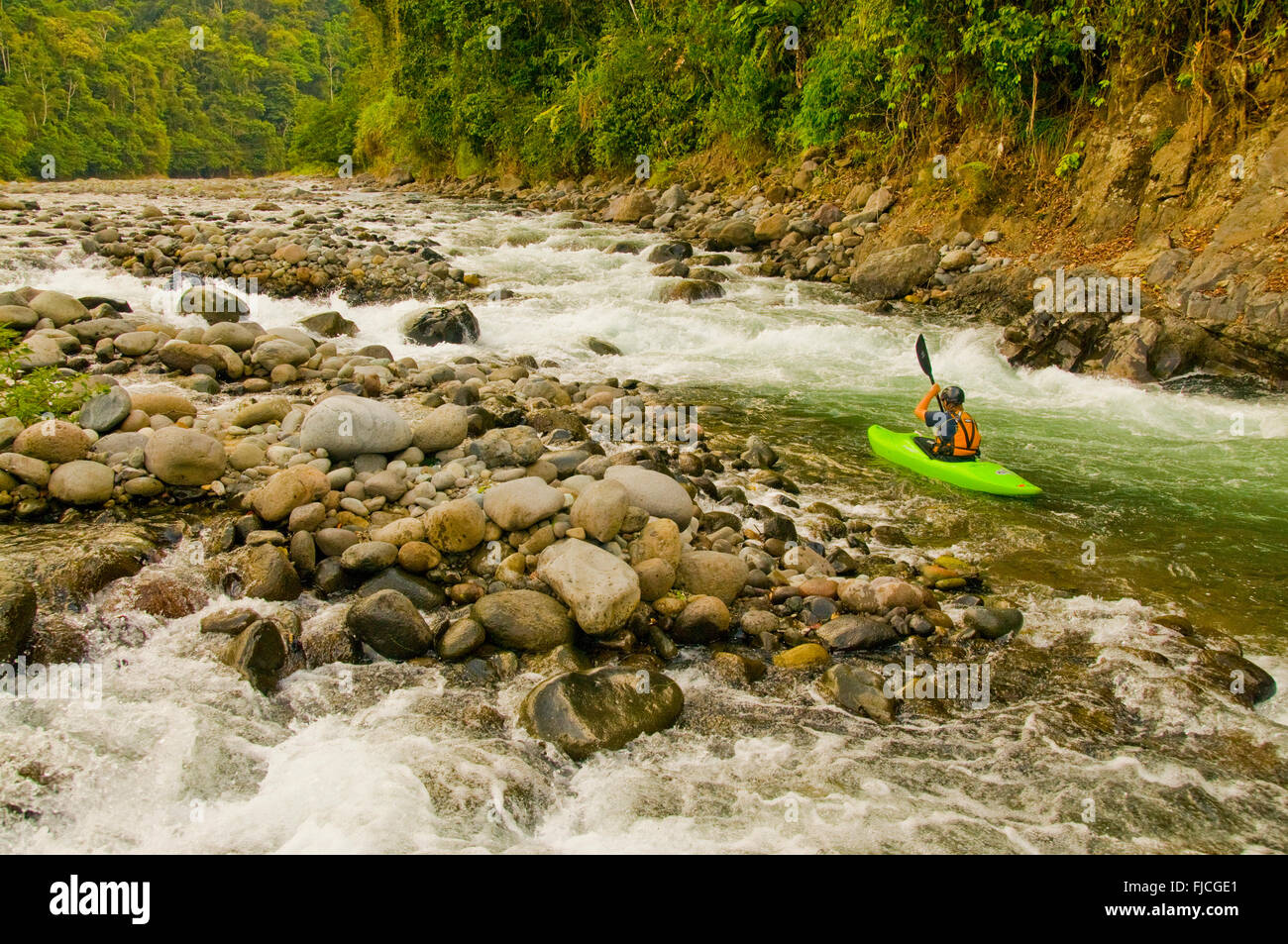 Kayaker paddling on the Lower Pacuare River. Costa Rica Stock Photo