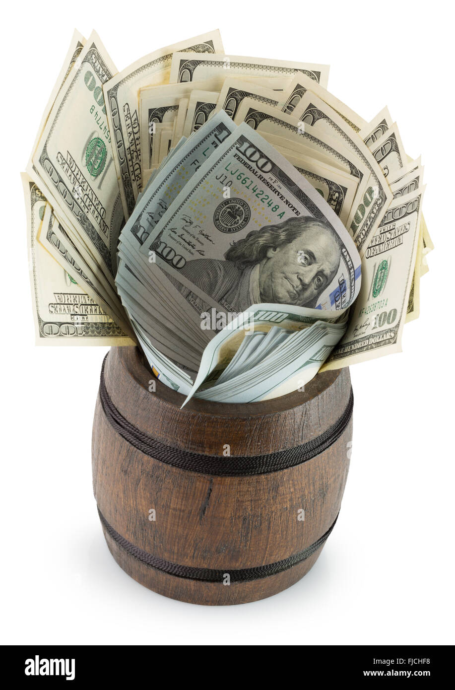 dollars in wooden barrel isolated on the white background. Stock Photo